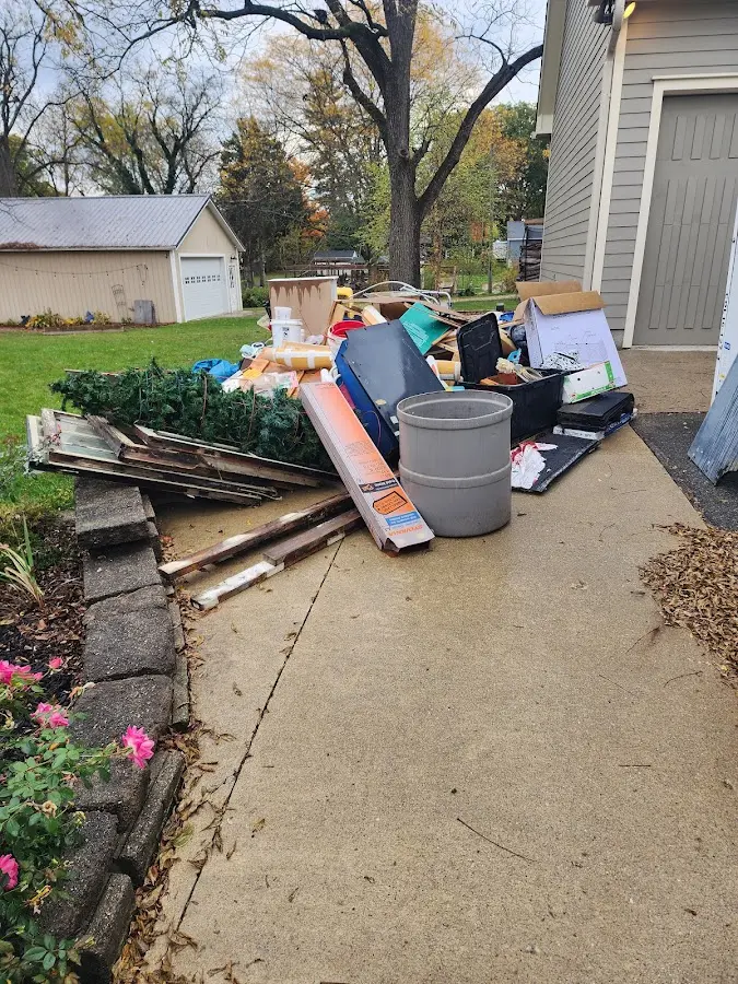 Dumpster being loaded with debris for Commercial Dumpster Rental in Muscoy